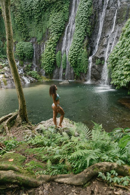 Solo travelers embracing freedom and adventure in exotic destinations, showcasing determination as they hike, explore, or relax in breathtaking natural landscapes.