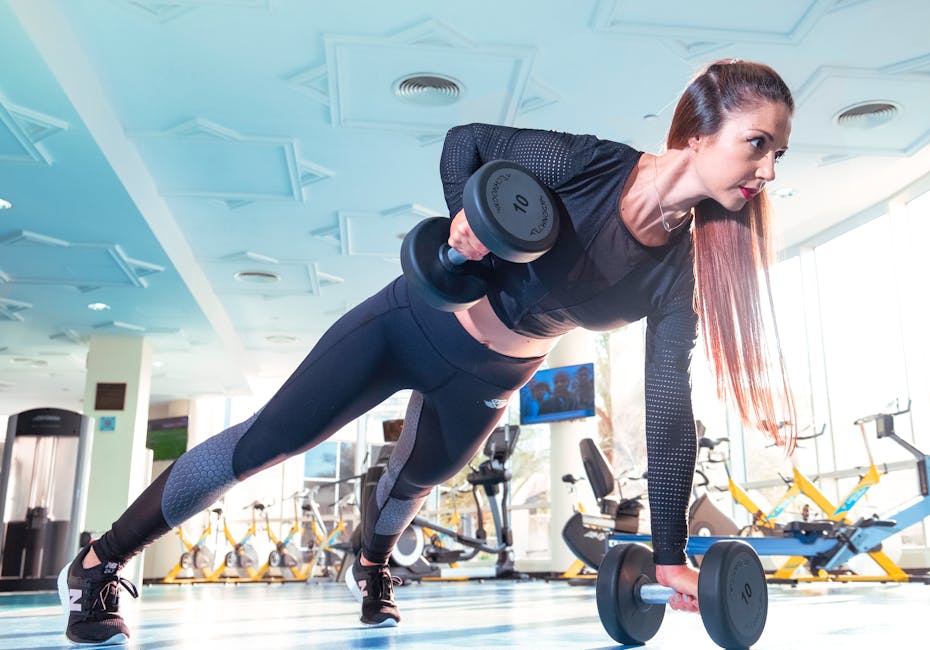 A fitness woman performing incorrect form on exercise equipment, struggling with weights and body positioning in a gym setting.