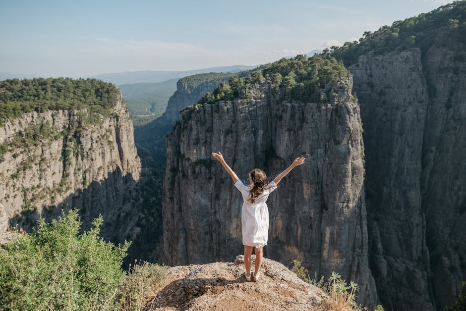 Outdoor enthusiasts engaging in adventure activities like hiking, kayaking, and rock climbing amidst a picturesque natural setting.