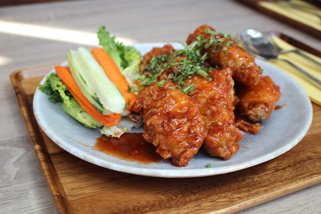 Colorful plate of seemingly healthy whole foods contaminated with added sugars, artificial flavorings, and other hidden unhealthy ingredients in nutrition.